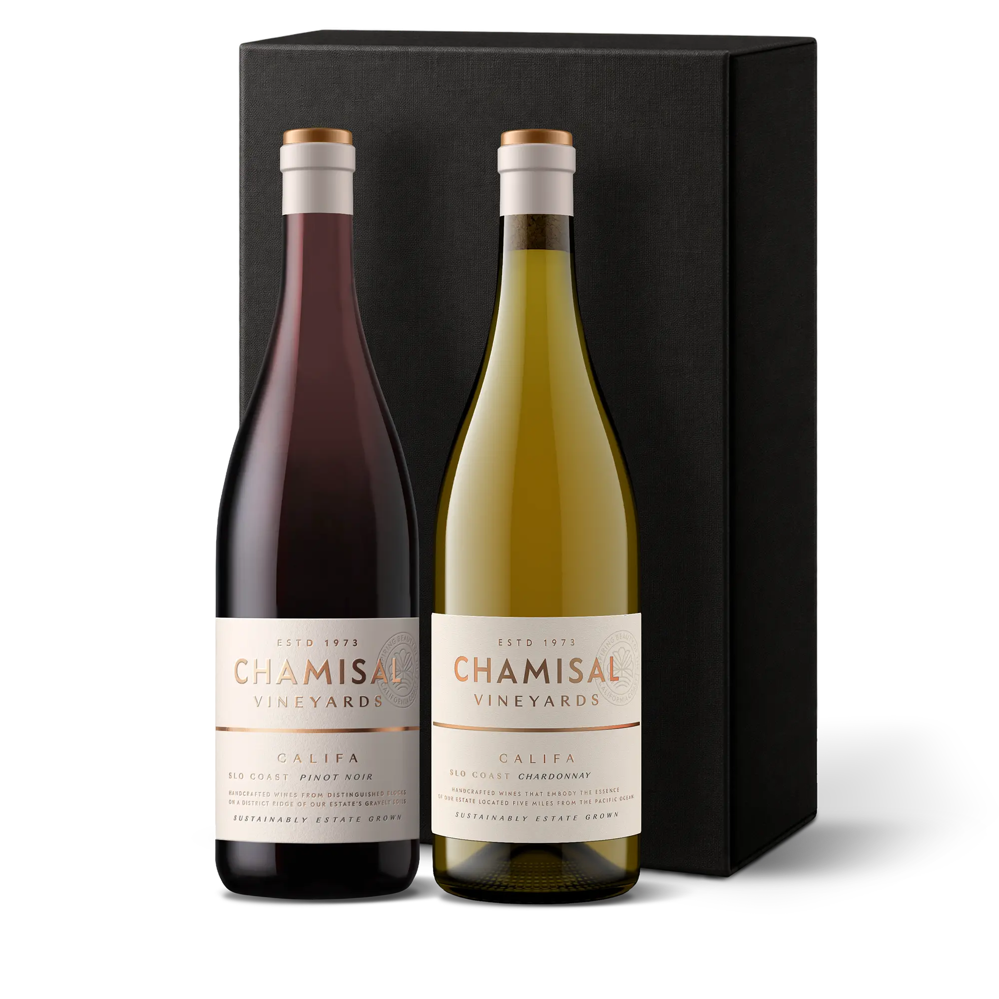 Two bottles of Chamisal Vineyards wine—one Califa Chardonnay and one Pinot Noir—stand in front of a tall black gift box. Each bottle has a white label with gold details and the winery’s name, creating an elegant Califa Chardonnay & Pinot Noir 2-Bottle Gift presentation.