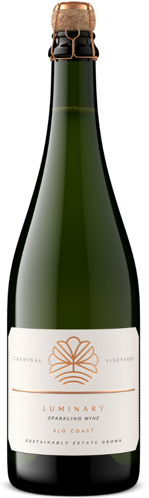 A bottle of Chamisal Vineyards Luminary Sparkling Wine with a gold foil top and a white label featuring gold accents and text stating it is from the SLO Coast and sustainably estate grown.